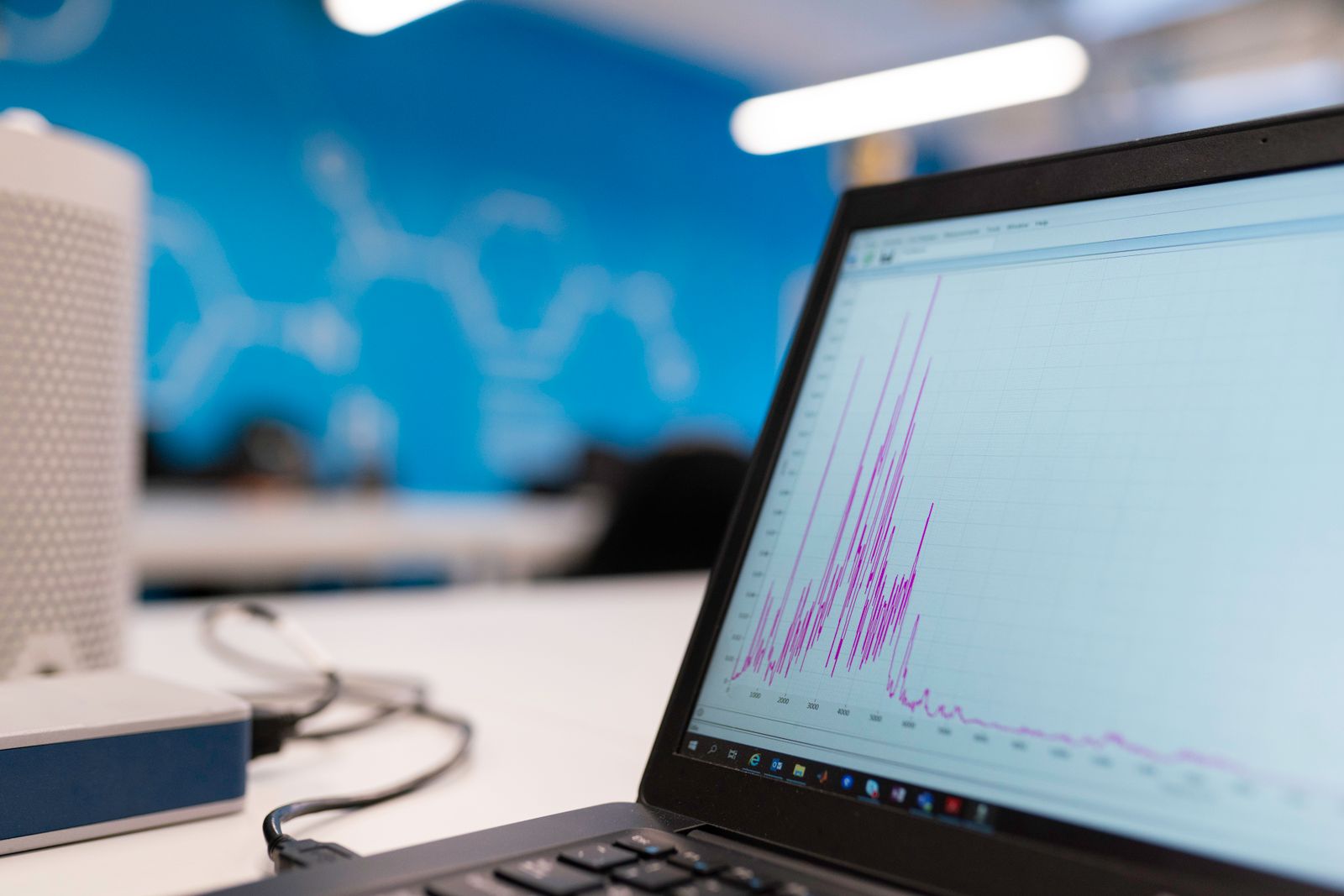 A laptop showing analytics and a vertical edit side by side, the desk where a reel gets its final quality check before it is posted.