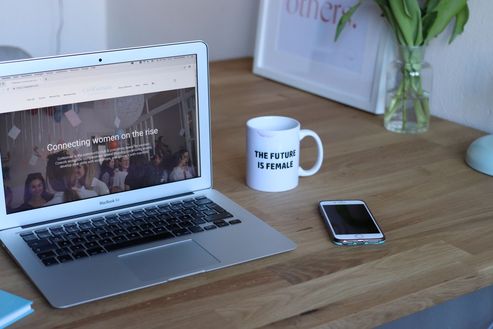 A laptop and a phone side by side on a desk, a reminder to check a tutorial on the small screen where most viewers will actually follow your steps.