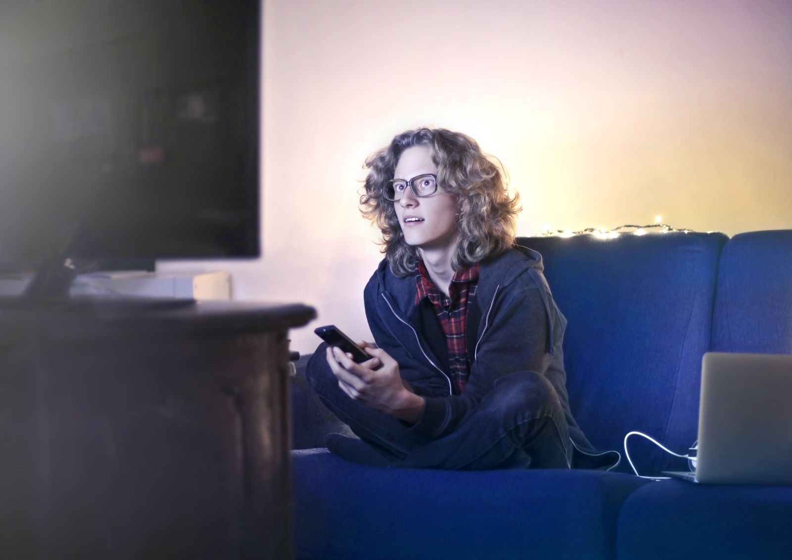 A phone and a TV showing the same video side by side, the test that exposes whether subtitles stay readable when they shrink from a big screen down to a hand.