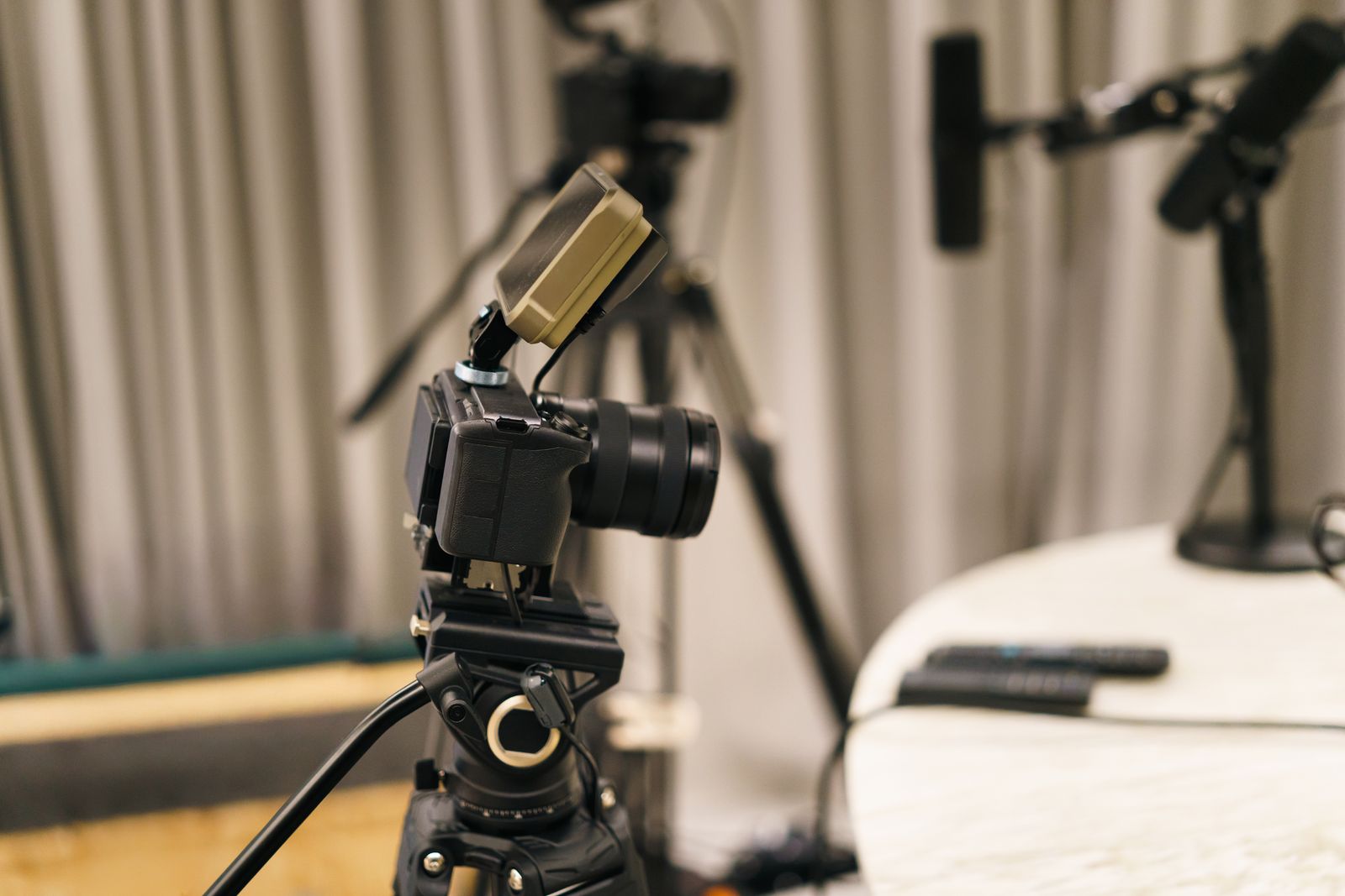 A tidy desk recording setup with a microphone and screen, the kind of workspace where a clear, well-paced tutorial video gets recorded and checked before it is published.